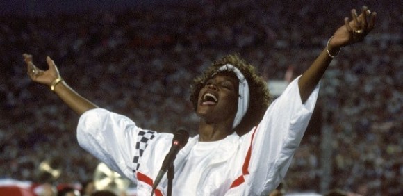 TAMPA, FL - JANUARY 27: Whitney Houston sings the National Anthem before a game with the New York Giants taking on the Buffalo Bills prior to Super Bowl XXV at Tampa Stadium on January 27, 1991 in Tampa, Florida. The Giants won 20-19. (Photo by George Rose/Getty Images)