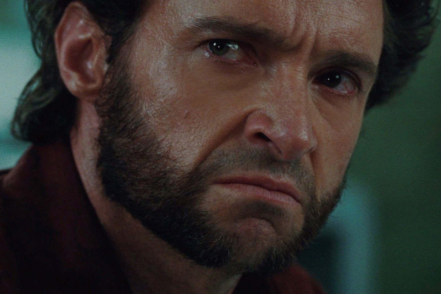 Close-up of Hugh Jackman looking tense as Wolverine