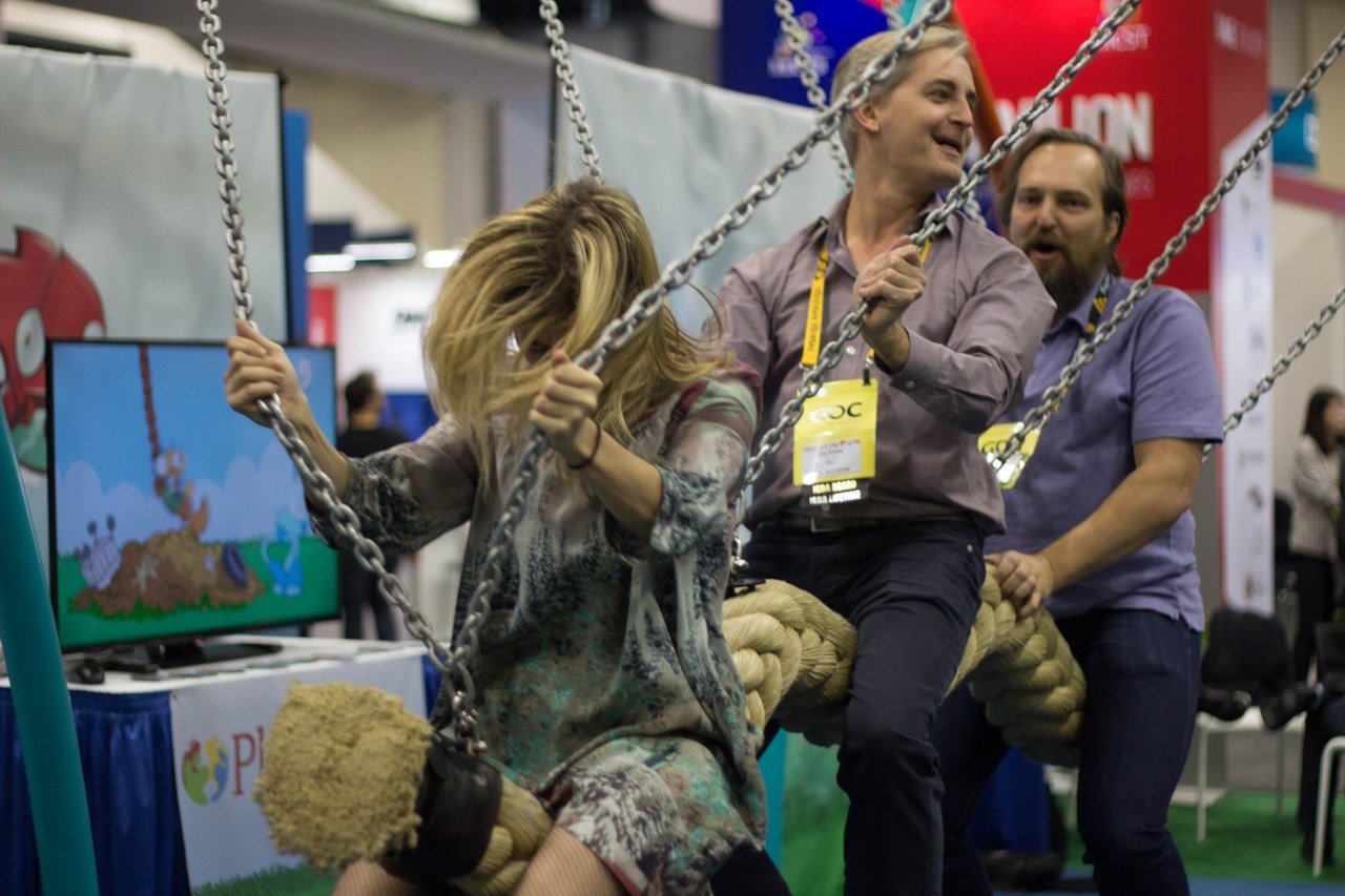 GDC attendees playing a game where you ride a rope swing. No lines for this one, if you can believe it.