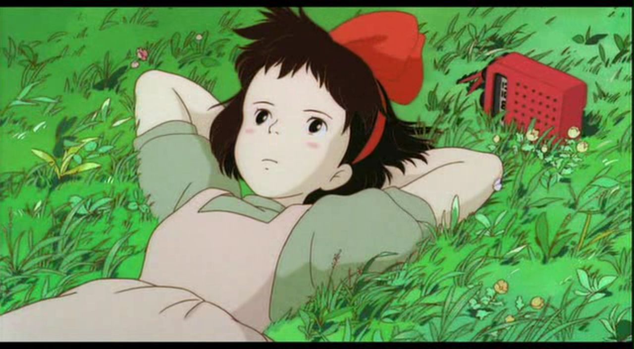 Kiki Lying On Grass
