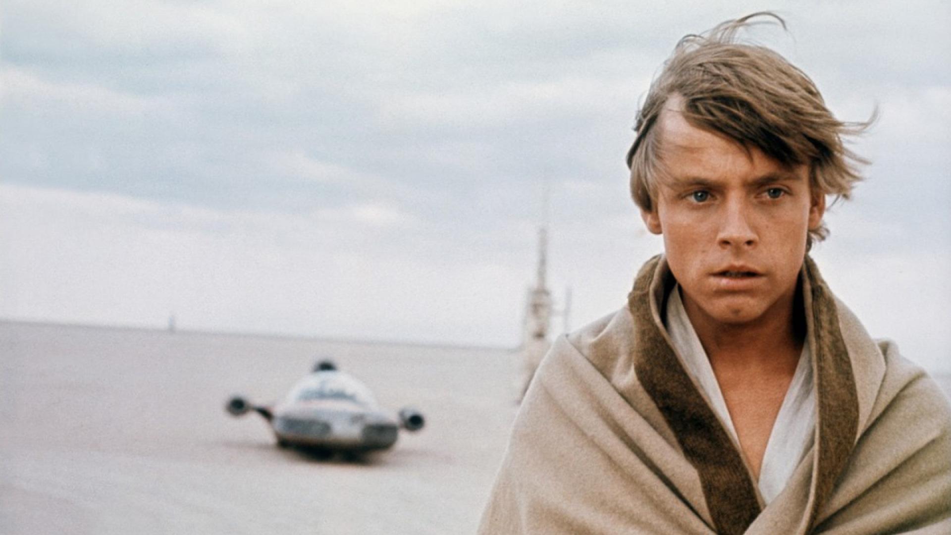 Luke Skywalker stands alone on Tatooine in Star Wars.