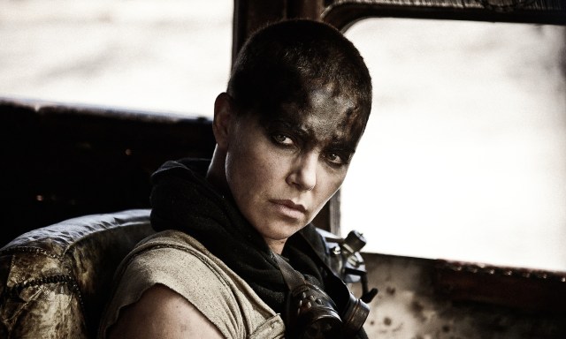 This photo provided by Warner Bros. Pictures shows Charlize Theron as Imperator Furiosa in Warner Bros. Pictures and Village Roadshow Pictures action adventure film, Mad Max: Fury Road," a Warner Bros. Pictures release. (Jasin Boland/Warner Bros. Pictures via AP)