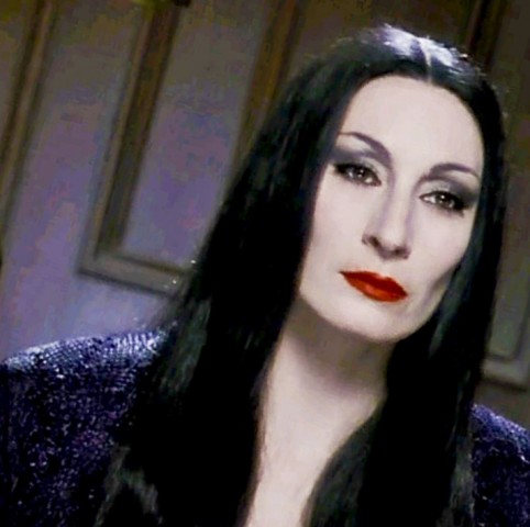 Anjelica Huston as Morticia Addams.
