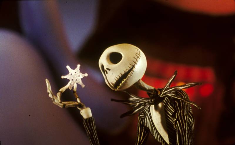Jack Skellington looks at a snowflake in A Nightmare Before Christmas.