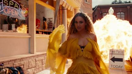 Beyonce walking away from an explosion in the Lemonade video.
