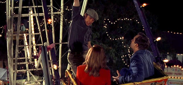 Ryan Gosling hanging from ferris wheel.