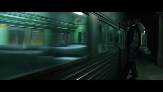 Neo dodges the subway train