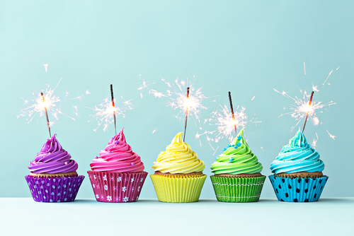 http://www.shutterstock.com/pic-247490812/stock-photo-row-of-colorful-cupcakes-with-sparklers.html?src=csl_recent_image-1