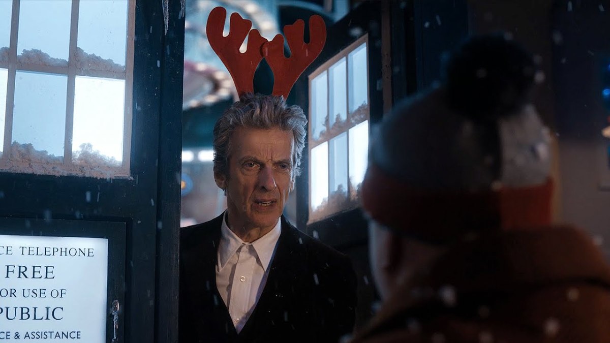 Peter Capaldi's 12th Doctor wearing a reindeer antler headband for Christmas