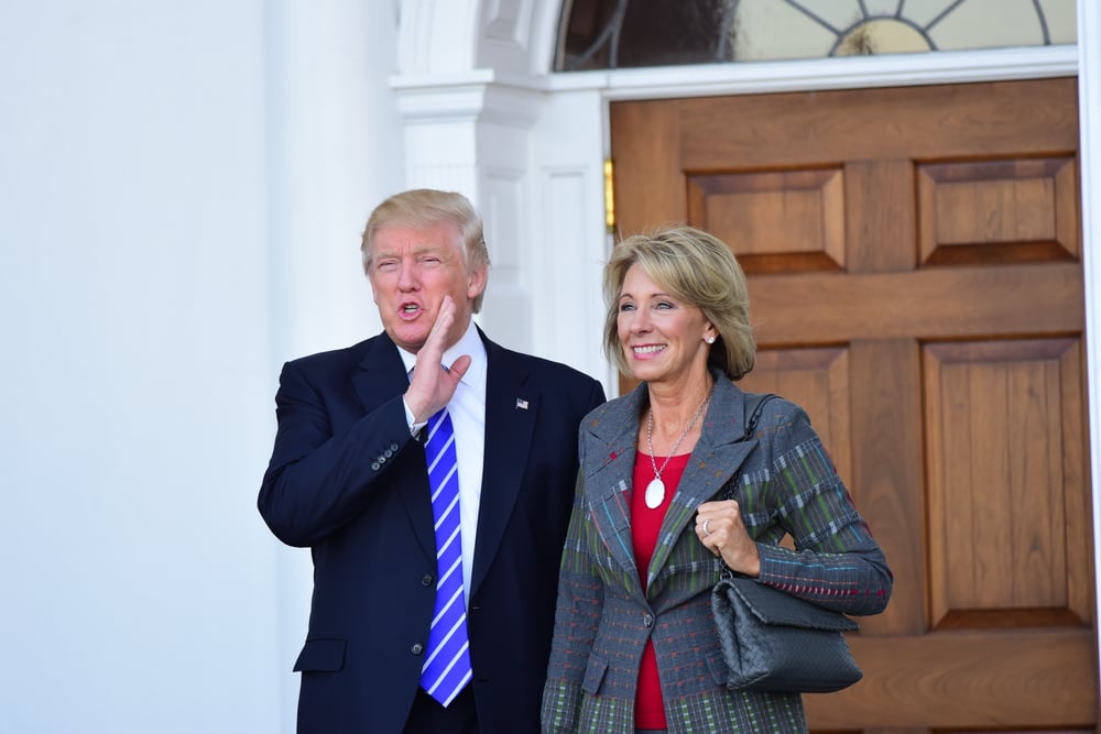 Image of Betsy Devos and Donald Trump, via Shutterstock