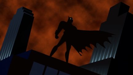 Batman standing atop a building in the opening sequence for Batman: The Animated Series.