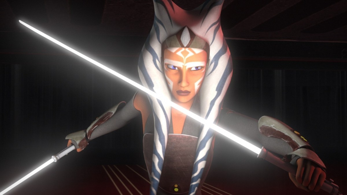 Ahsoka Tano holding lightsabers in Star Wars.