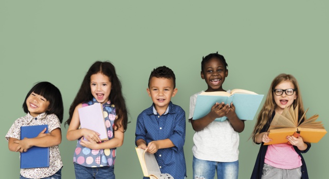 Image: Shutterstock.com A group of children reading books