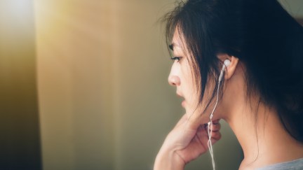 Woman headphones political podcast list best podcasts news
