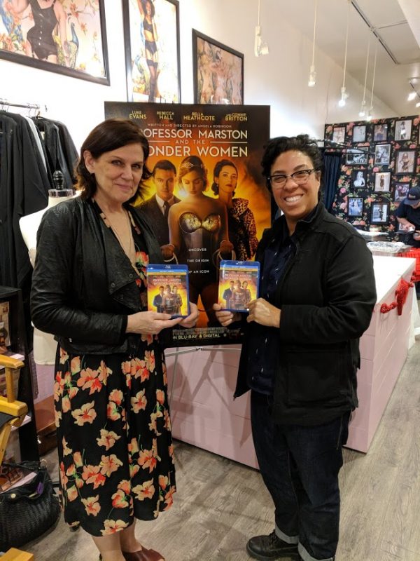 image: Teresa Jusino Donna Maloney and Angela Robinson at the Blu-ray release party for "Professor Marston and the Wonder Women" at What Katie Did in Burbank, CA