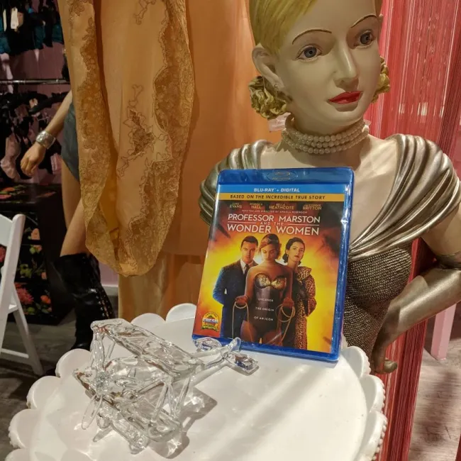 image: Teresa Jusino The "Professor Marston and the Wonder Women" Blu-ray along with the prop "invisible plane" toy from the film.