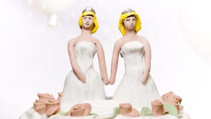 brides on wedding cake