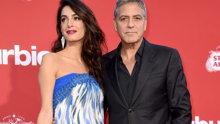 image: Kevin Winter/Getty Images LOS ANGELES, CA - OCTOBER 22: Executive producer George Clooney (R) and his wife Amal Clooney arrive at the premiere of Paramount Pictures' 