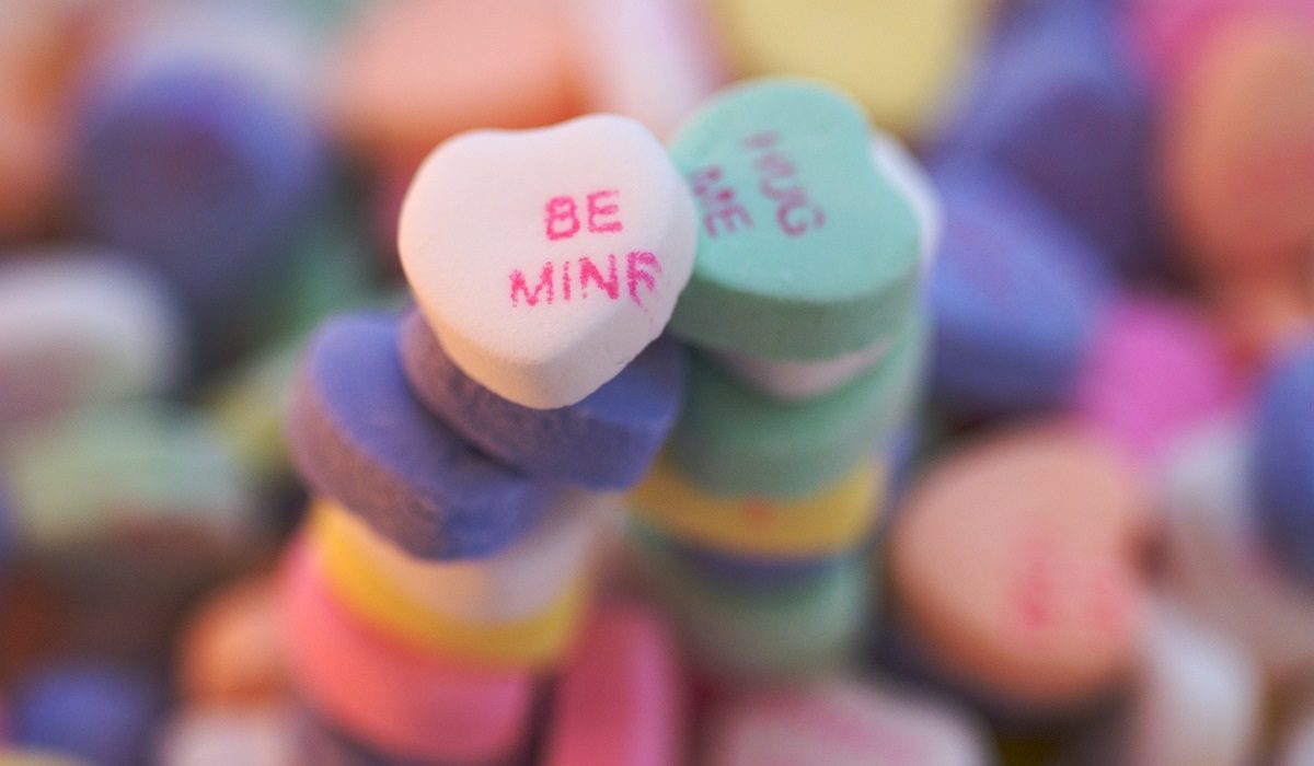 Image of candy hearts that say, "Be Mine" and "Hug Me" for Valentine's Day Image credit: https://www.flickr.com/photos/fdotguido/