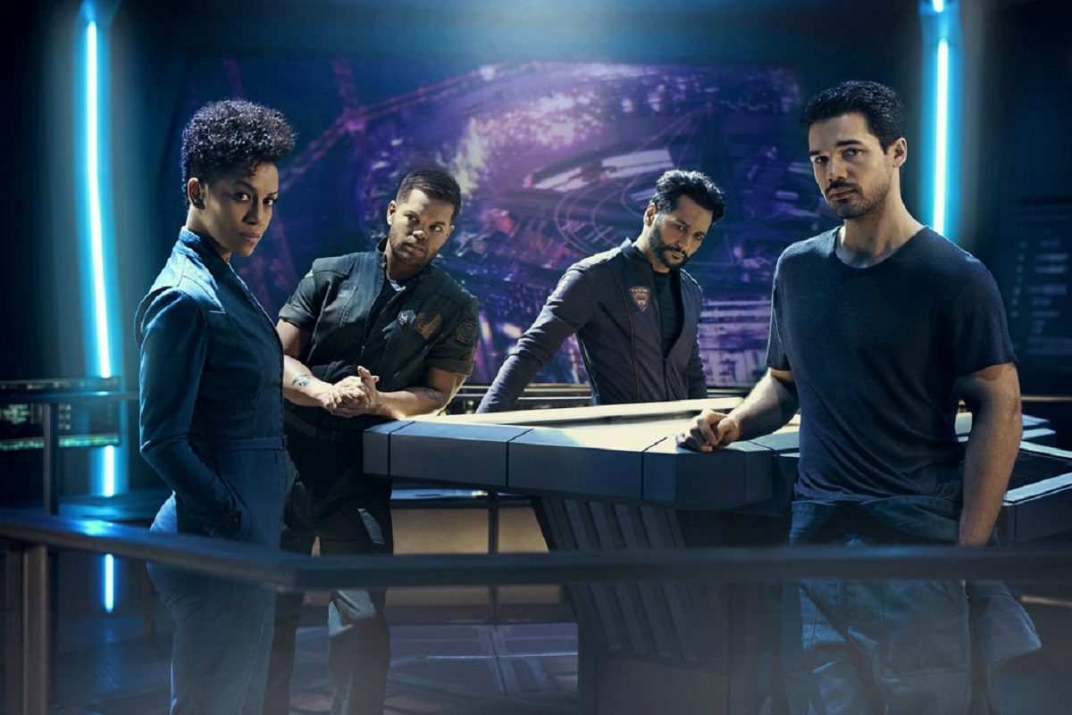 Image of "The Expanse," featuring Dominique Tipper as Naomi Nagata, Wes Chatham as Amos Burton, Cas Anvar as Alex Kamal, and Steven Strait as James Holden (Photo credit: Kurt Iswarienko / Syfy)