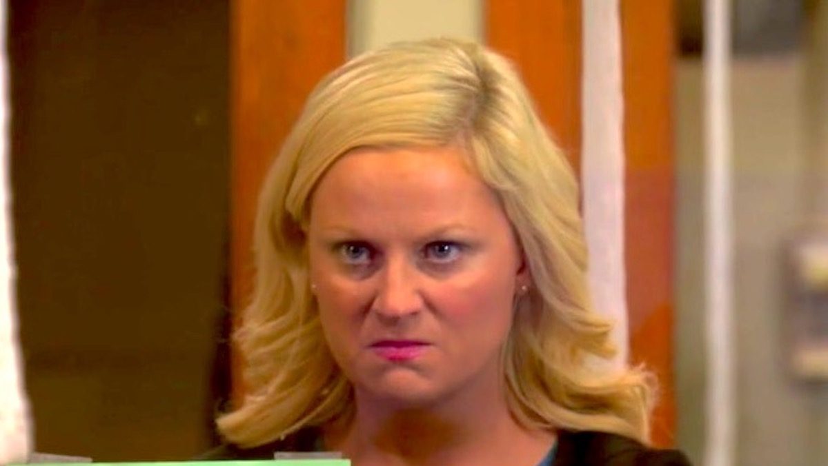 Amy Poehler as Leslie Knope on Parks and Recreation angry at Greg Pikitis because he's a little turd.
