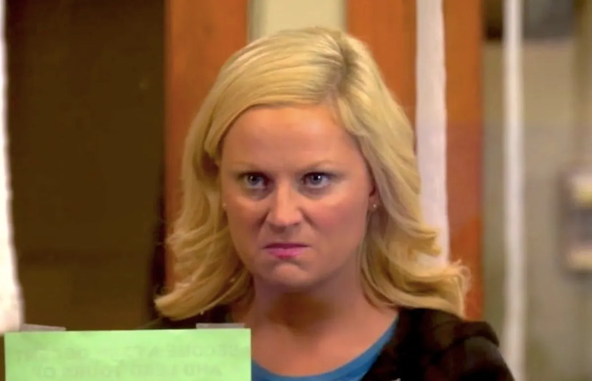 Amy Poehler as Leslie Knope on Parks and Recreation angry at Greg Pikitis because he's a little turd.