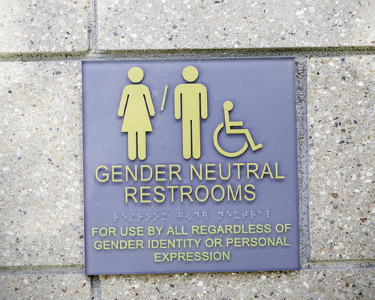Shutterstock image of a gender-neutral restroom sign with wheelchair accessibility 