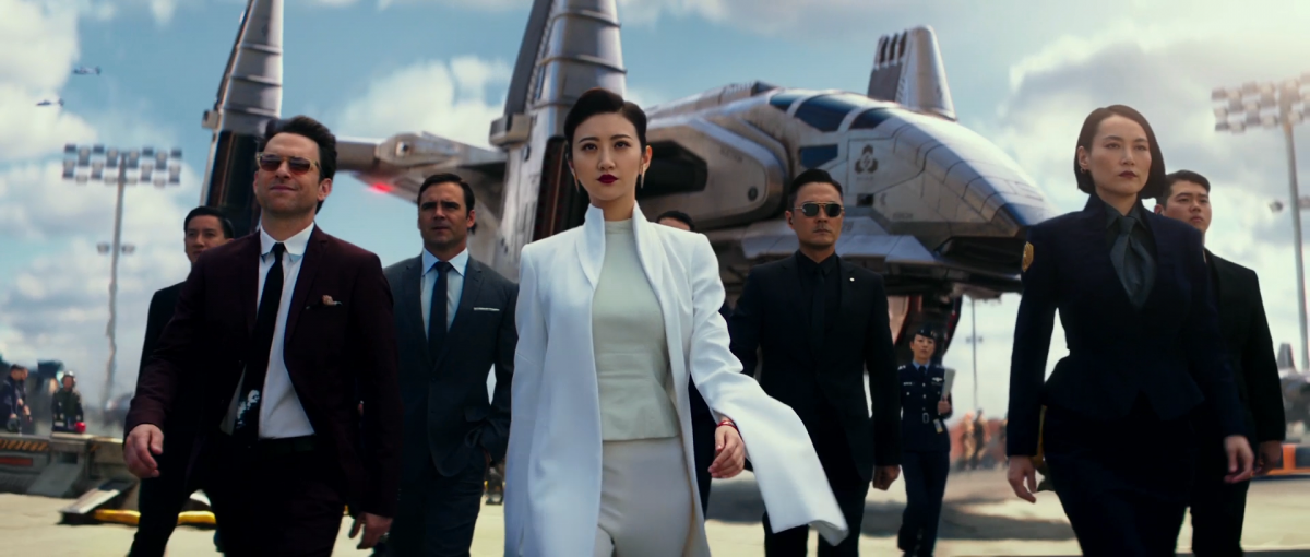 "Newt" (Charlie Day), Liwen Shao (Jing Tian) and Mako Mori (Rinko Kikuchi) in a scene from "Pacific Rim: Uprising" 