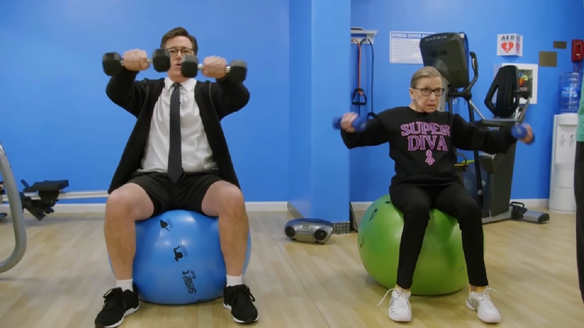 Screengrab of Justice Ruth Bader Ginsburg working out with Stephen Colbert