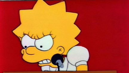Lisa Simpson stands in front of a microphone looking furious at democracy.