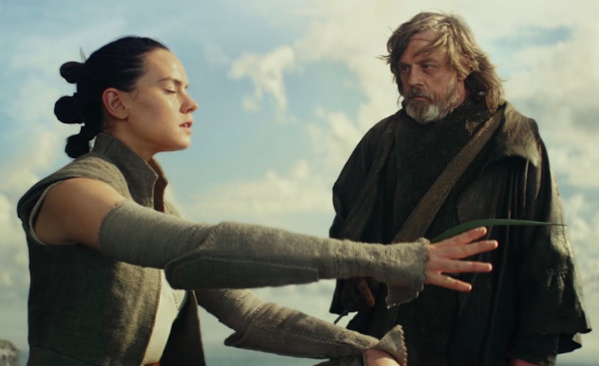Luke tickling Rey's hand as "the Force" in Star Wars: The Last Jedi