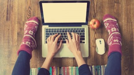 woman typing on computer