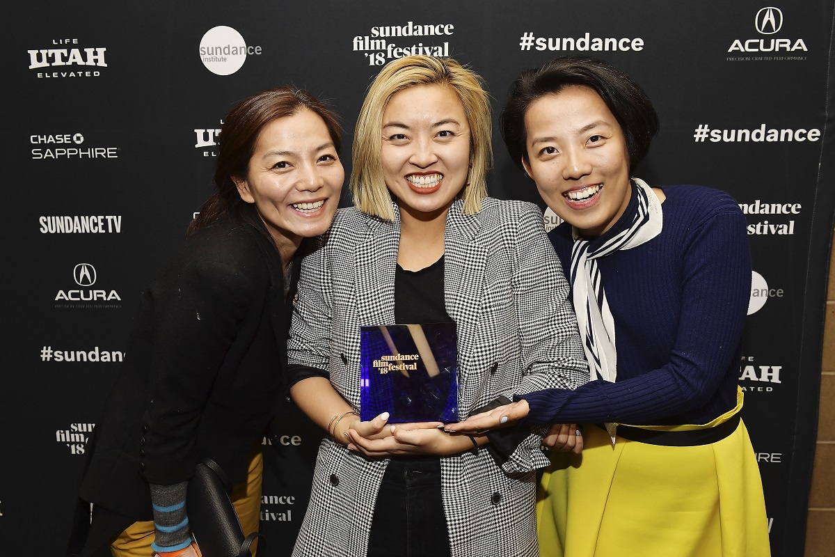 PARK CITY, UT - JANUARY 27: (L-R) Producer Jane Zheng, director Cathy Yan, and producer Clarissa Zhang backatage after accepting the Special Jury Award for Ensemble Acting for their film "Dead Pigs" at Basin Recreation Field House on January 27, 2018 in Park City, Utah. 