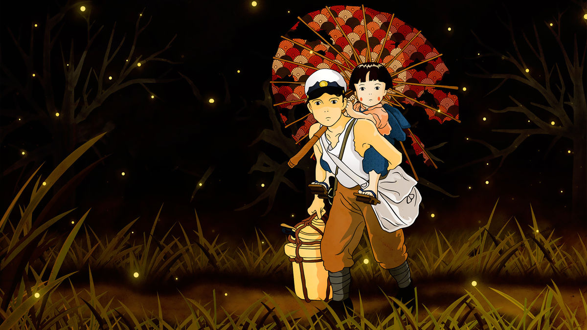 A still from 'Grave of the Fireflies', a young boy carries a small child on his back
