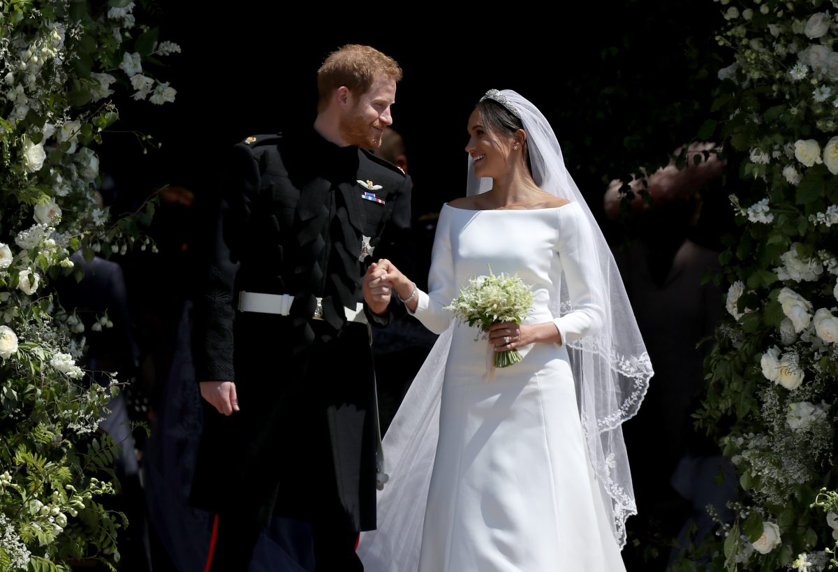 WINDSOR, UNITED KINGDOM - MAY 19: Prince Harry, Duke of Sussex and The Duchess of Sussex share a kiss after their wedding at St George's Chapel at Windsor Castle on May 19, 2018 in Windsor, England. 
