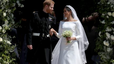 WINDSOR, UNITED KINGDOM - MAY 19: Prince Harry, Duke of Sussex and The Duchess of Sussex share a kiss after their wedding at St George's Chapel at Windsor Castle on May 19, 2018 in Windsor, England.
