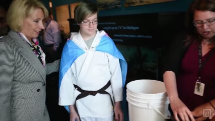 transgender flag betsy devos protest troll