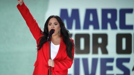 Demi Lovato addresses the March for Our Lives rally on on March 24, 2018 in Washington, DC. Hundreds of thousands of demonstrators, including students, teachers and parents gathered in Washington for the anti-gun violence rally organized by survivors of the Marjory Stoneman Douglas High School school shooting on February 14 that left 17 dead and 17 others wounded. More than 800 related events are taking place around the world to call for legislative action to address school safety and gun violence.