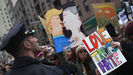 trump putin protest, homophobia, signs
