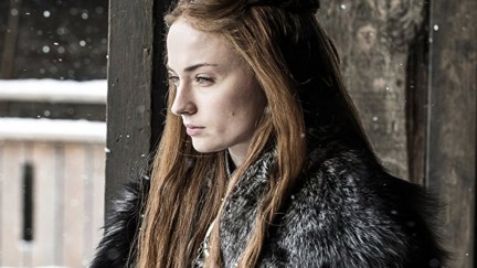 Sophie Turner as Sansa Stark gazing outside in Game of Thrones.