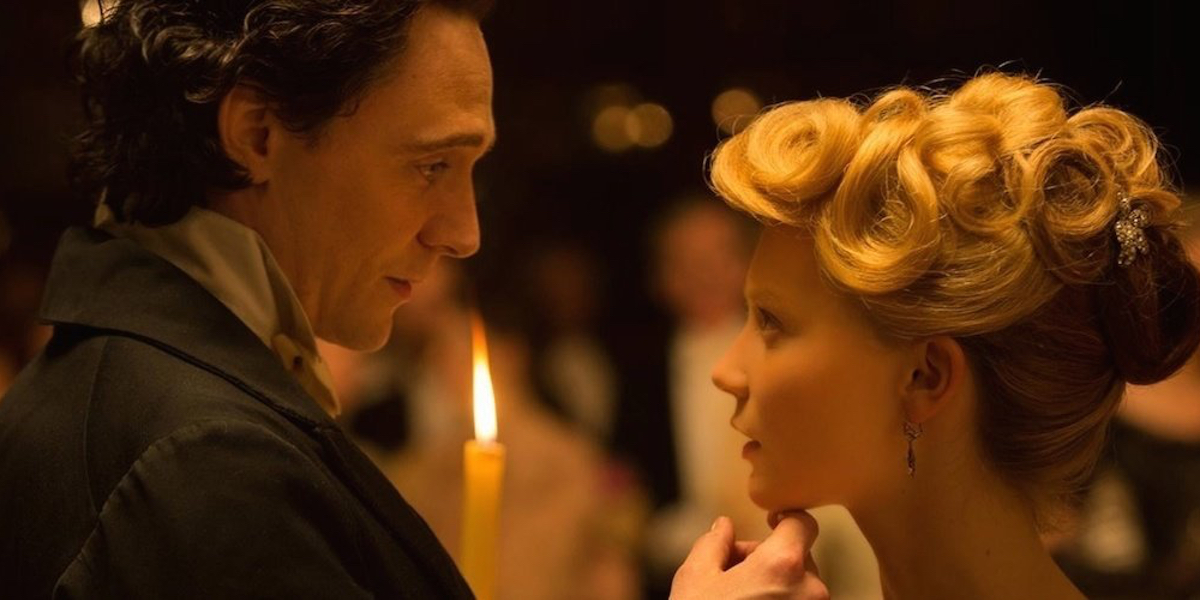 Tom Hiddleston and Mia Wasikowska staring deeply at each other in "Crimson Peak"
