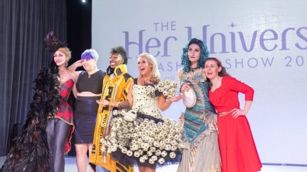 The winners of the 2018 Her Universe Fashion Show pose with Ashley Eckstein in this photo by Brian Sims