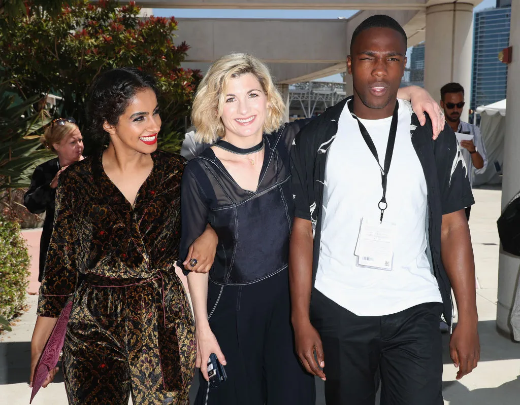 Mandip Gill, Jodie Whittaker, and Tosin Cole pose together.