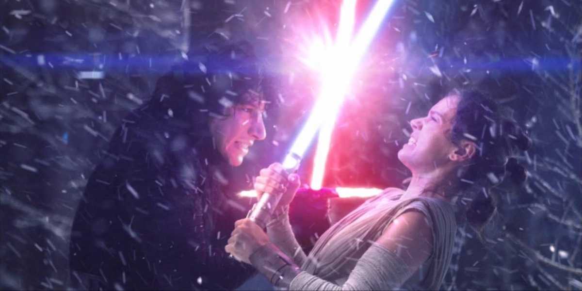 Daisy Ridley's Rey locked in combat with Adam Driver's Kylo Ren in Star Wars: The Force Awakens