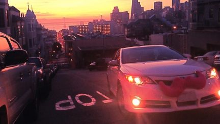 car with pink mustache