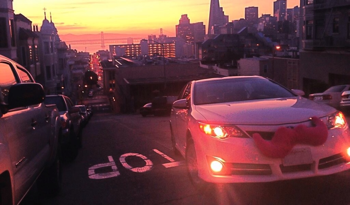 car with pink mustache