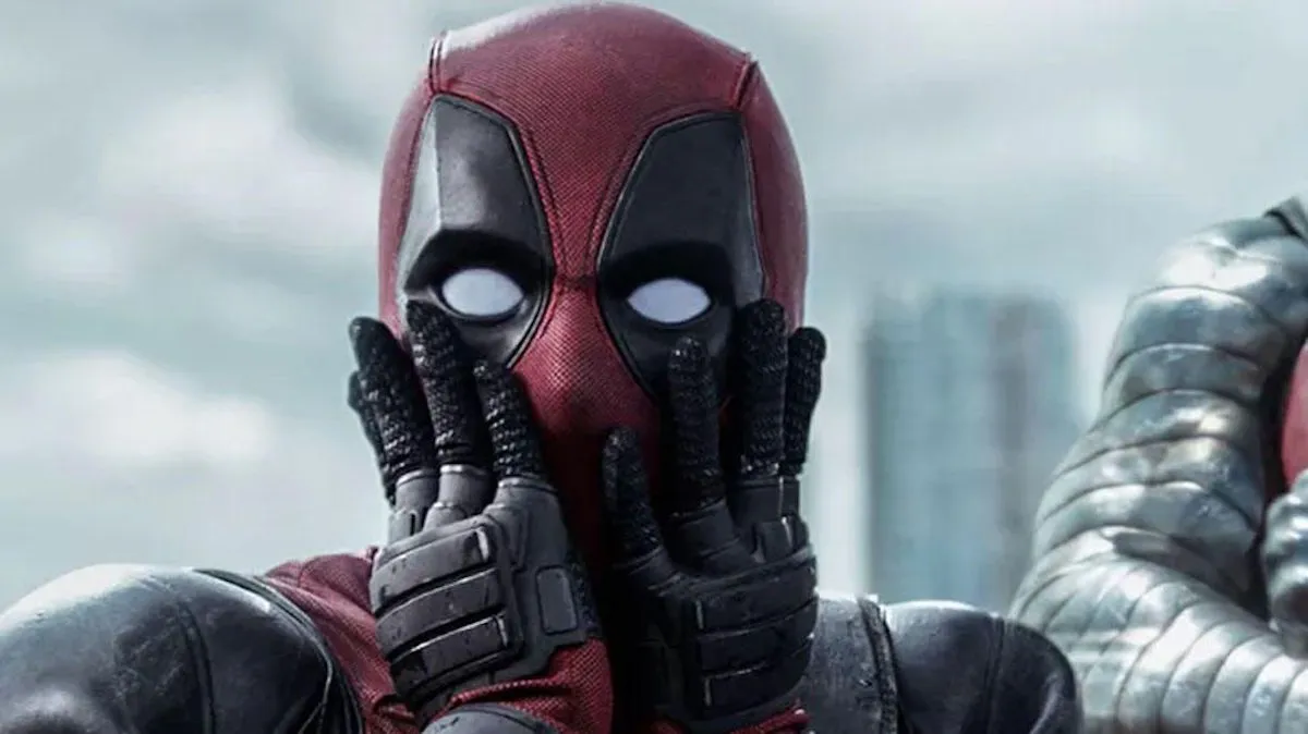 Deadpool gasping with his hands pressed to his face.