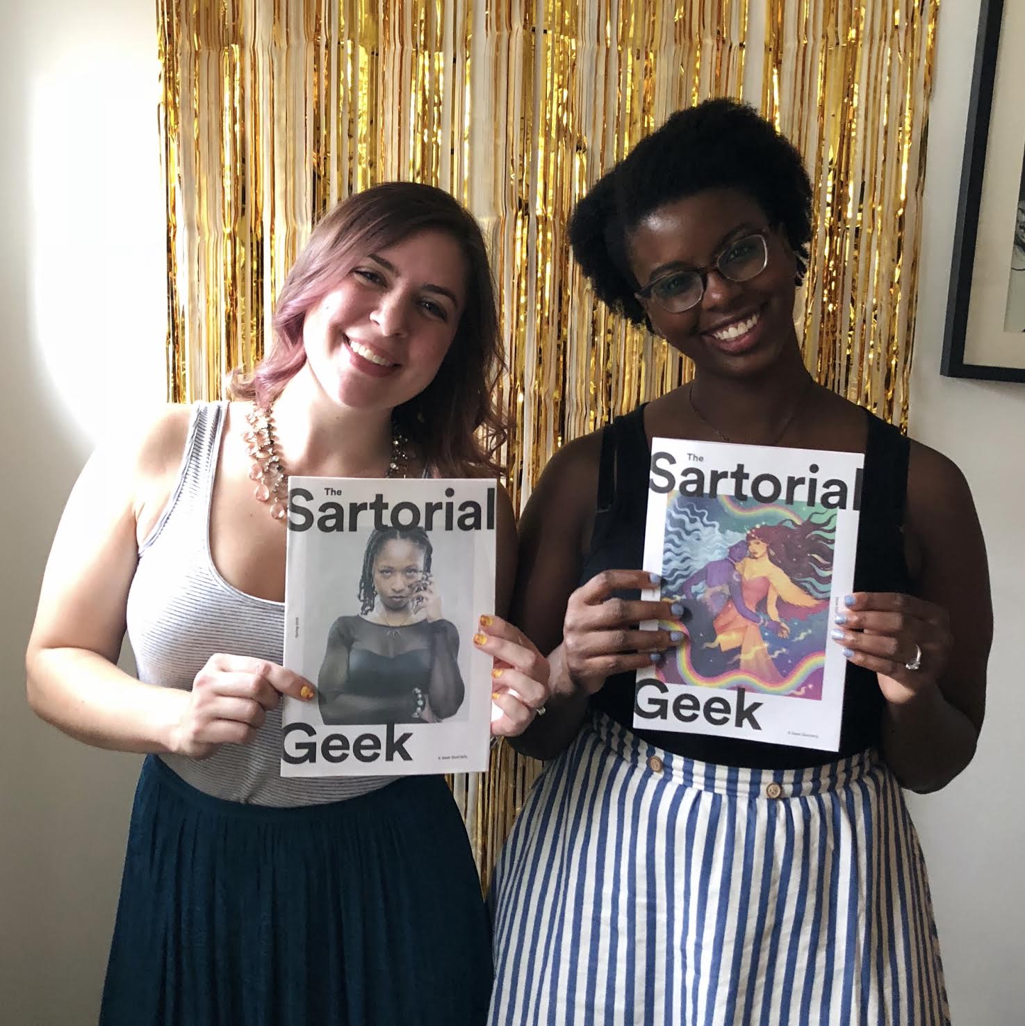 Jordan Ellis, the founder of Jordandené and The Sartorial Geek, poses with her magazine