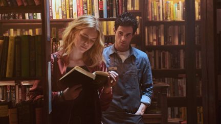 penn badgley as Joe looms behind elizabeth lail as Beck in Netflix's You