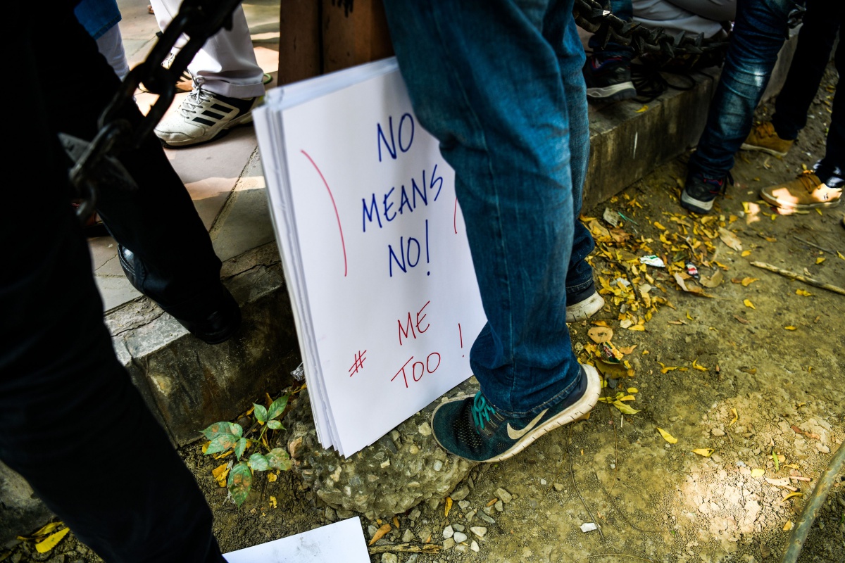 A placard is kept next to an Indian journalist at a protest against sexual harassment in the media industry in New Delhi on October 13, 2018. - India's #MeToo movement has engulfed Bollywood figures, a government minister and several comedians and top journalists. (Photo by CHANDAN KHANNA / AFP) (Photo credit should read CHANDAN KHANNA/AFP/Getty Images)